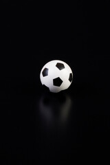 Fototapeta na wymiar soccer ball on black