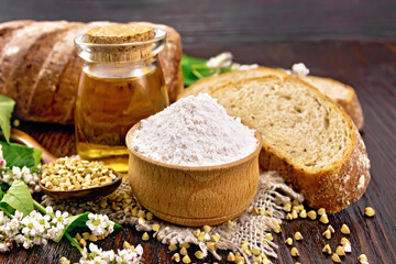 Flour buckwheat green in bowl with bread on board