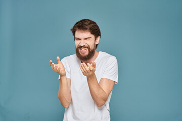 man in white t-shirt gesturing with his hands studio cropped