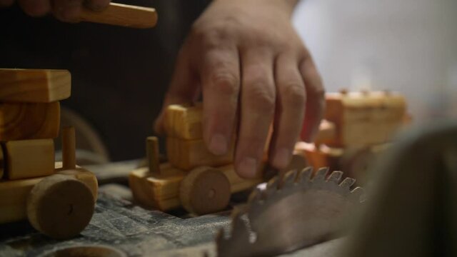 Adult Hands Building a Wood Train