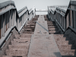 Upstairs of people cross bridge