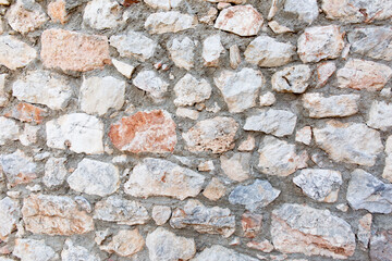 Antique stone wall. Old gray bricks background.