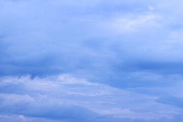 Beautiful blue sky background. Heavenly, gentle empty background. Blue and white bright atmosphere. Fantastic soft clouds.
