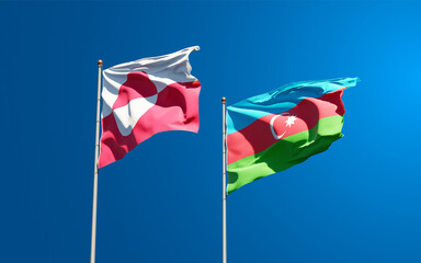 Beautiful national state flags of Greenland and Azerbaijan together at the sky background. 3D artwork concept.