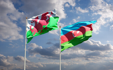 Beautiful national state flags of Wales and Azerbaijan together at the sky background. 3D artwork concept.
