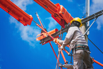 The lineman used tie stick to carve the tie wire used to wrap the electrical wires attached to the...