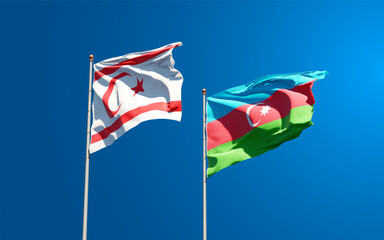 Beautiful national state flags of Turkish Republic of Northern Cyprus and Azerbaijan together at the sky background. 3D artwork concept.