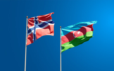 Beautiful national state flags of Norway and Azerbaijan together at the sky background. 3D artwork concept.