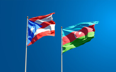 Beautiful national state flags of Puerto Rico and Azerbaijan together at the sky background. 3D artwork concept.