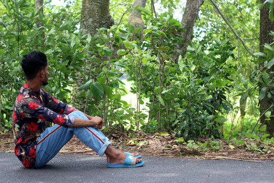 the teenager costs on a footpath in the wood