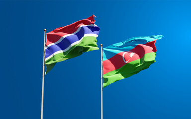 Beautiful national state flags of Gambia and Azerbaijan together at the sky background. 3D artwork concept.