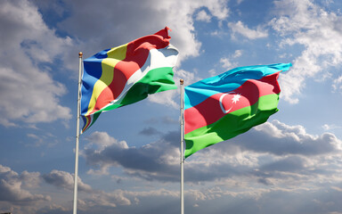 Beautiful national state flags of Seychelles and Azerbaijan together at the sky background. 3D artwork concept.