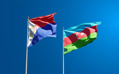 Beautiful national state flags of Sint Maarten and Azerbaijan together at the sky background. 3D artwork concept.