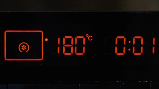 Close-up, stove oven timer, touch panel. Temperature control and timer on the oven.