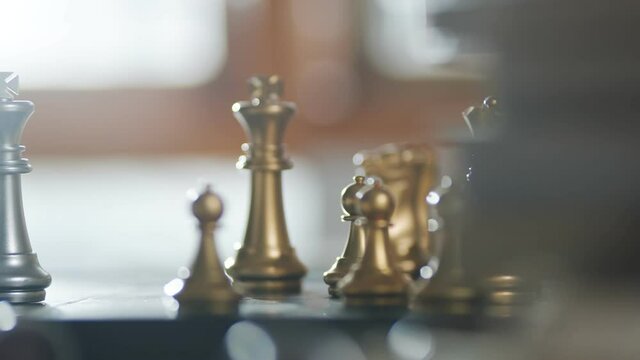 dolly shot of close up chess board game business strategy ideas concept with blur bokeh background