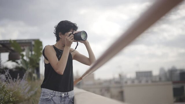 Pro level female photographer clicking landscape photos at Barcelona