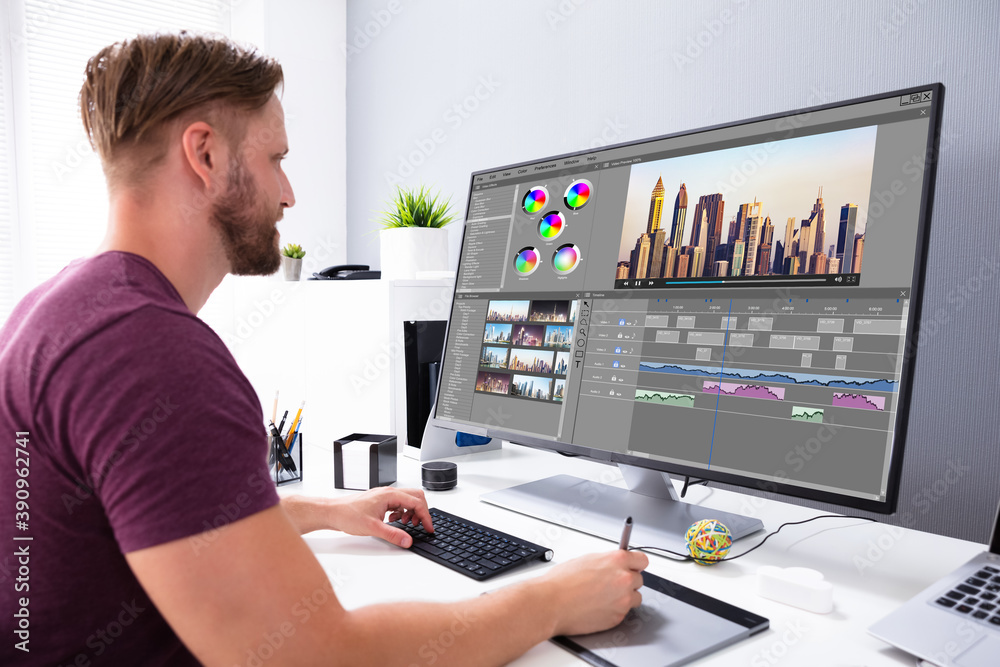 Poster Designer Editing Photo On Computer