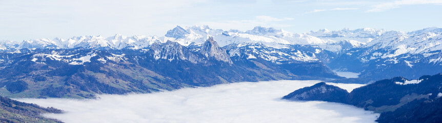 Fototapeta na wymiar Sunshine over the fog sea on the Rigi Klum snow mountain in winter season, Swiss Alps, Switzerland (large stitched file)