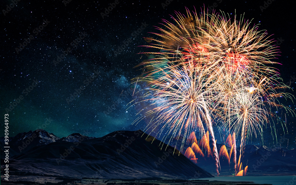 Wall mural colorful of fireworks display on milkyway in night sky background.