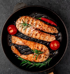 grilled salmon steaks in a cast iron grill pan