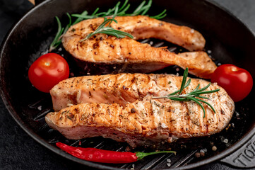 grilled salmon steaks in a cast iron grill pan