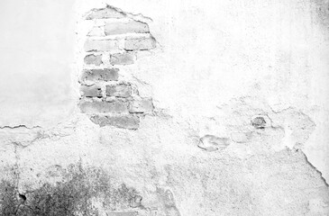 Black and white photo of old masonry, the old stained brick wall cracked and decaying used for...