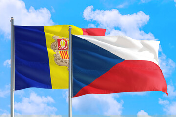 Czech Republic and Andorra national flag waving in the windy deep blue sky. Diplomacy and international relations concept.