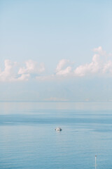 Fototapeta na wymiar Beautiful Turkish coast with blue sea. Light landscape with a minimalistic style.