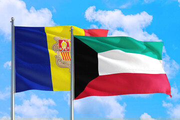 Kuwait and Andorra national flag waving in the windy deep blue sky. Diplomacy and international relations concept.