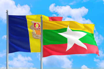 Myanmar and Andorra national flag waving in the windy deep blue sky. Diplomacy and international relations concept.