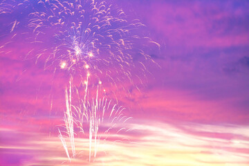 Colorful of fireworks display on sky in the pastel background.