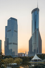Naklejka premium Sunset view of the modern architectures in Lujiazui, Shanghai, China.