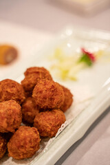 Deep fried pork meatballs, traditional Beijing cuisine in China.
