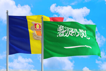 Saudi Arabia and Andorra national flag waving in the windy deep blue sky. Diplomacy and international relations concept.