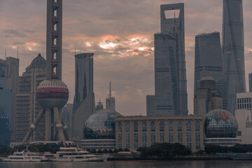 Sunrise view of Lujiazui, the financial district in Shanghai, China, on a cloudy day.