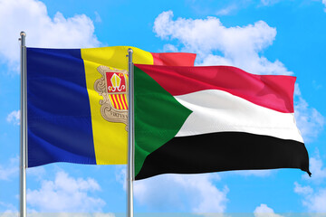 Sudan and Andorra national flag waving in the windy deep blue sky. Diplomacy and international relations concept.