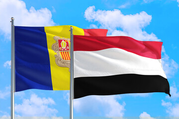 Yemen and Andorra national flag waving in the windy deep blue sky. Diplomacy and international relations concept.