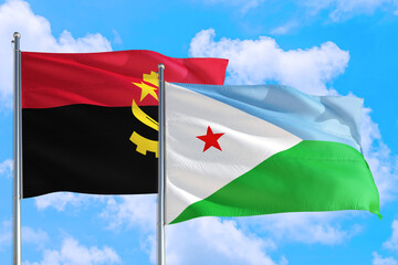 Djibouti and Angola national flag waving in the windy deep blue sky. Diplomacy and international relations concept.