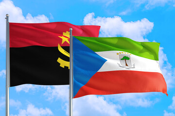 Equatorial Guinea and Angola national flag waving in the windy deep blue sky. Diplomacy and international relations concept.
