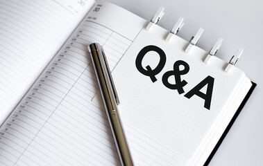 text Q and A on the short note texture background with pen