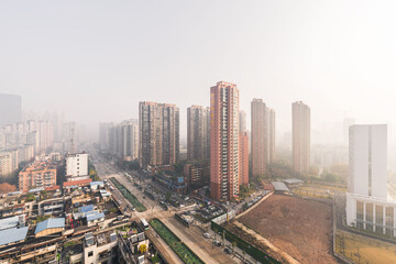 Fototapeta na wymiar Wuhan cityscapes after the covid-19, aerial view city buildings and skyline in a foggy morning
