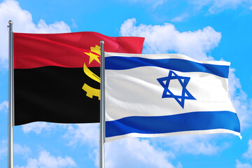 Israel and Angola national flag waving in the windy deep blue sky. Diplomacy and international relations concept.
