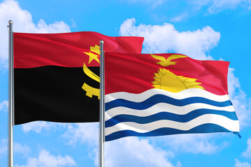 Kiribati and Angola national flag waving in the windy deep blue sky. Diplomacy and international relations concept.