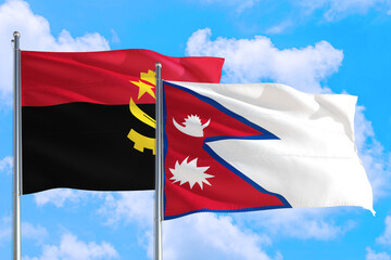 Nepal and Angola national flag waving in the windy deep blue sky. Diplomacy and international relations concept.
