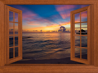 view from the open window at the sea sunset