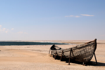 Fototapeta na wymiar A fishing vessel at Meob Bay on the Namib coast
