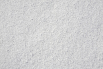 Snow texture. Shot on the slopes of the mountains.