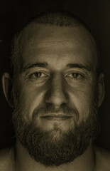 Studio session with one muscular man in low-key light conditions