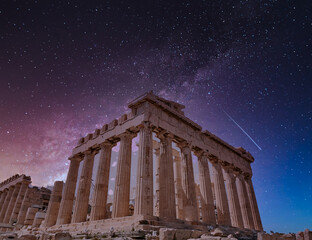 Parthenon ancient temple under dramatic starry sky, Athens Greece