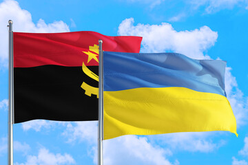 Ukraine and Angola national flag waving in the windy deep blue sky. Diplomacy and international relations concept.